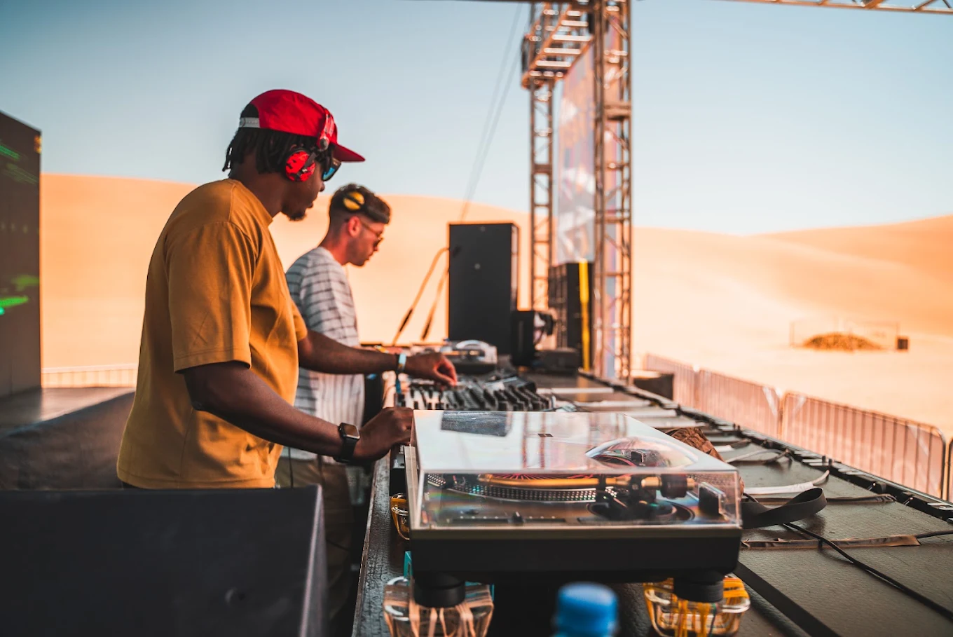 Sunset Groove — Outdoor summer festival featuring blazing lights, deep beats and coastal desert-heat vibes.